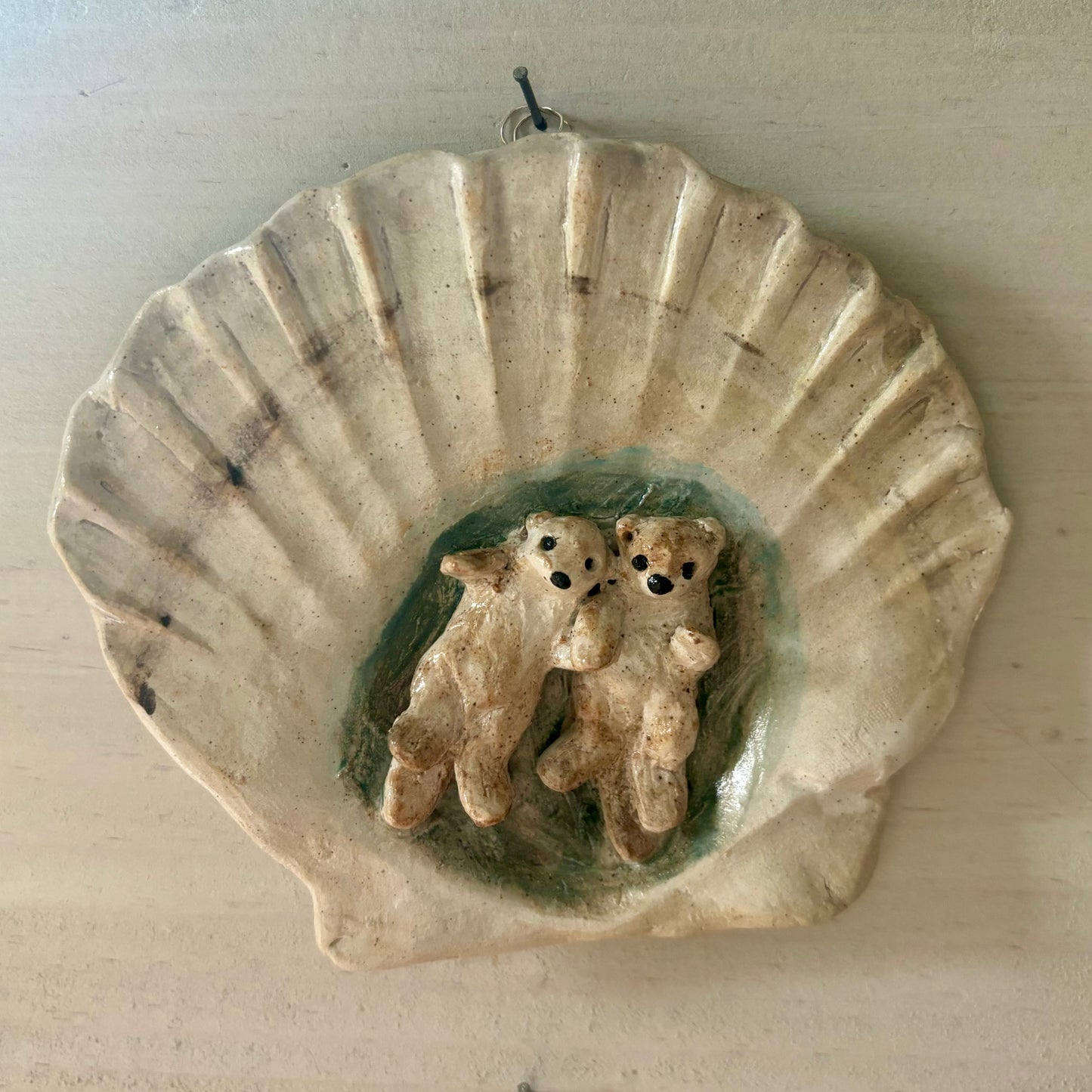 Ceramic wall hanging - otters