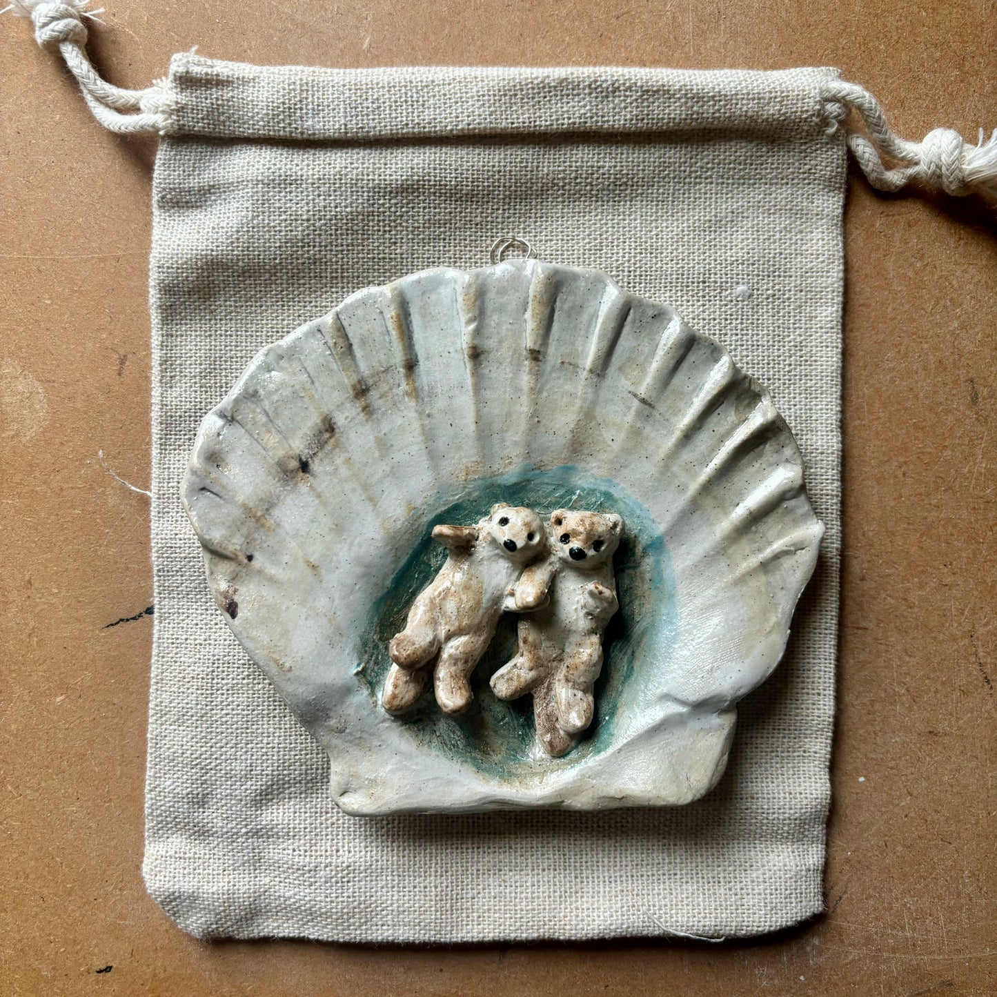 Ceramic wall hanging - otters